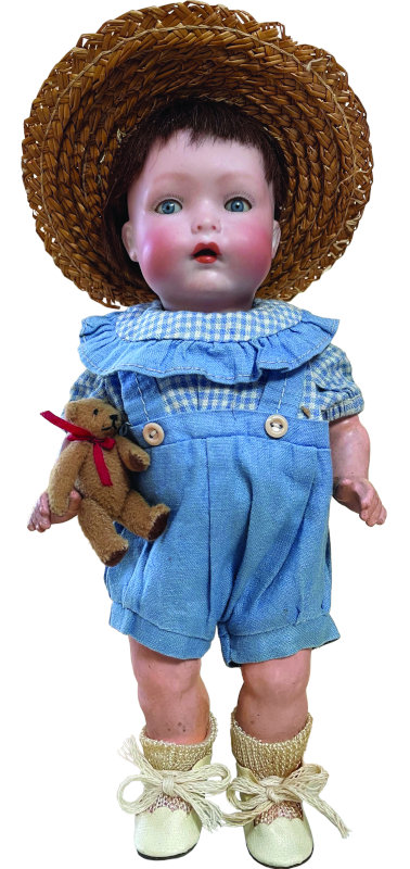 ABG mold number 1407, Baby Bo-Kaye with socket head, on a five-piece composition toddler body. He was designed by Joseph L. Kallus in 1925. His bisque head features sleeping glass eyes, chubby cheeks, and open mouth with two tiny lower teeth. He is 8.5 inches tall. Photo courtesy of the Foulke Archives