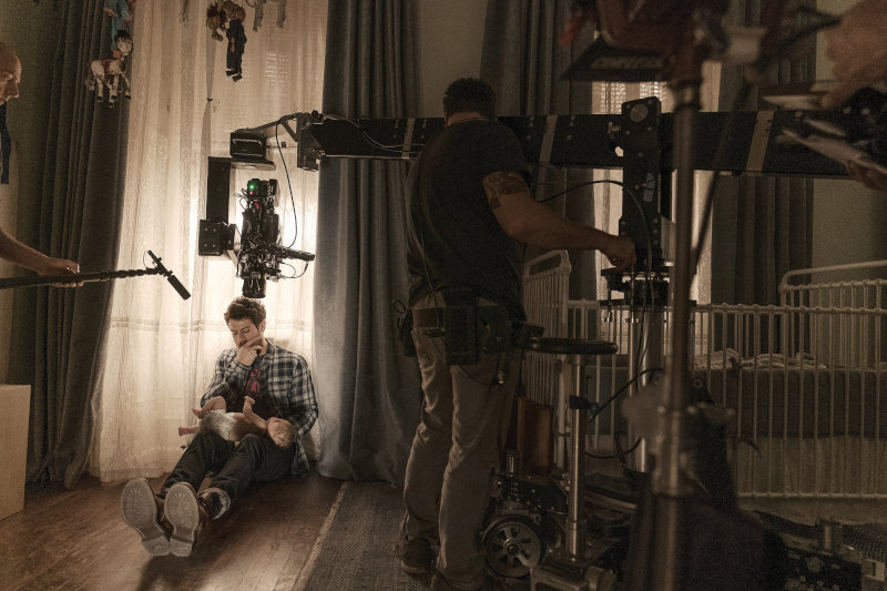 Actor Toby Kebbell holds the Jericho doll during the filming of Servant season 1. Photo by Jessica Kourkounis