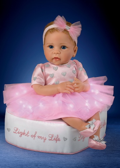 Light of My Life does just that, literally and figuratively. The Ashton-Drake charmer is an adorable baby doll, and her skirt physically lights up.