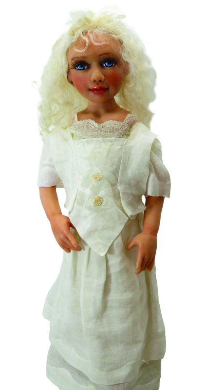 Moulton still has this doll which she sculpted from Cernit and Super Sculpey polymer clays. Her dress is fashioned from hankies and her hair is mohair.